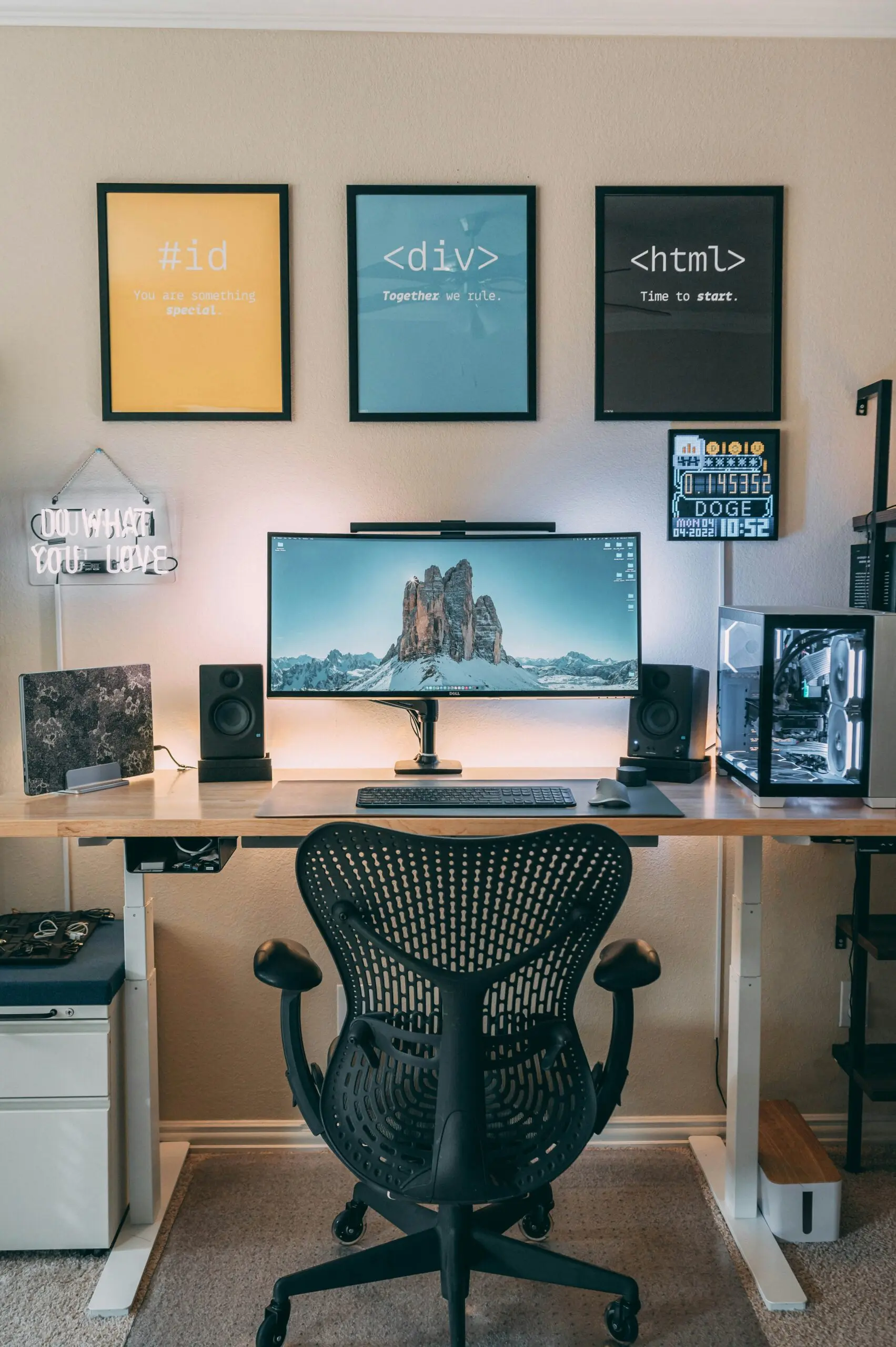 Developer workstation with monitor and code posters